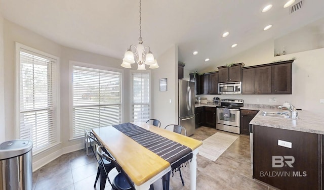 11116 Sturbridge Loop, Daphne, AL 36526 - kitchen with stainless steel appliances, a chandelier, dark brown cabinetry, a sink, and vaulted ceiling