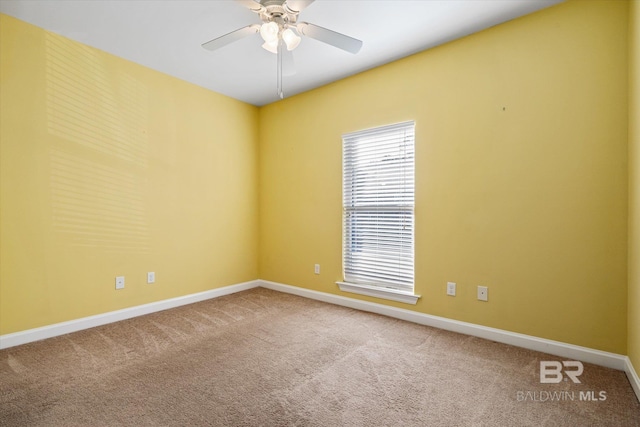 carpeted empty room with ceiling fan