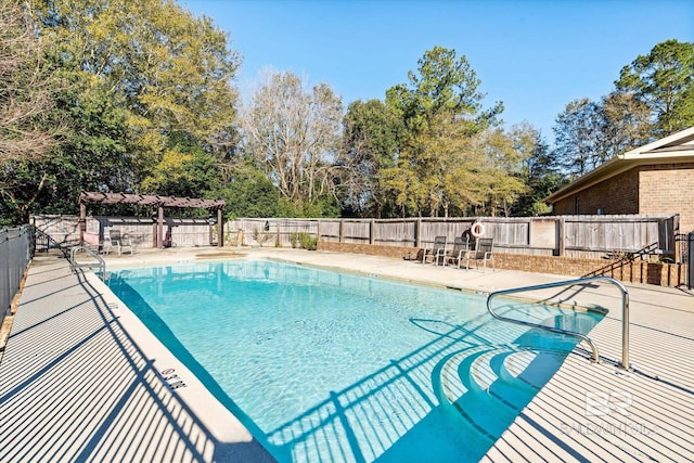 view of pool with a patio and a pergola