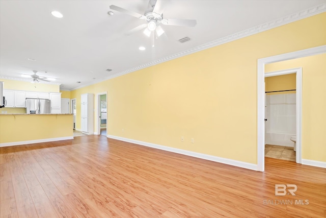 unfurnished living room featuring crown molding, ceiling fan, and light hardwood / wood-style flooring