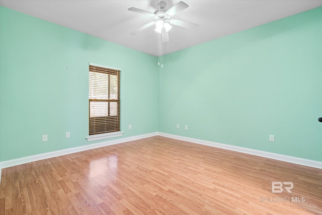 spare room featuring ceiling fan and light wood-type flooring