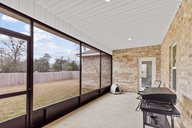 sunroom / solarium featuring a healthy amount of sunlight