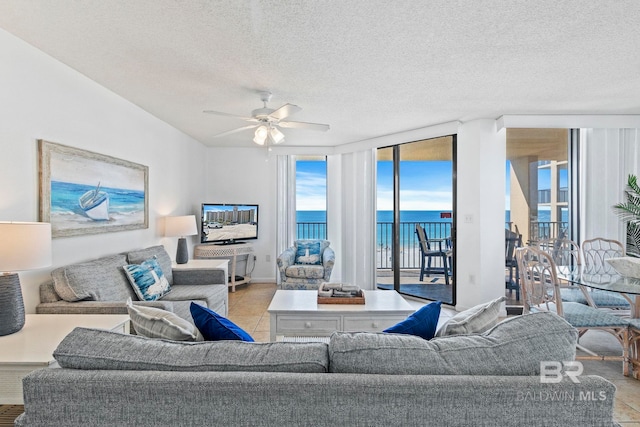 24400 Perdido Beach Blvd Unit 501, Orange Beach, AL 36561 - living room with light tile patterned flooring, a textured ceiling, expansive windows, and ceiling fan