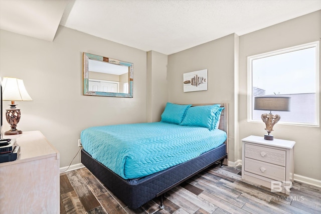 bedroom with hardwood / wood-style floors