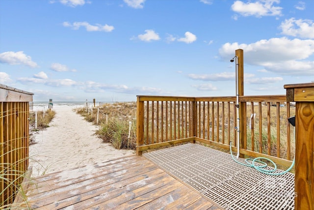 wooden deck featuring a water view