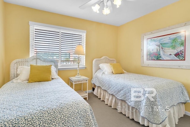 bedroom with ceiling fan and carpet