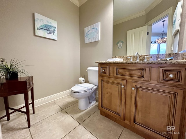 bathroom featuring tile patterned flooring, ornamental molding, toilet, vanity, and a chandelier