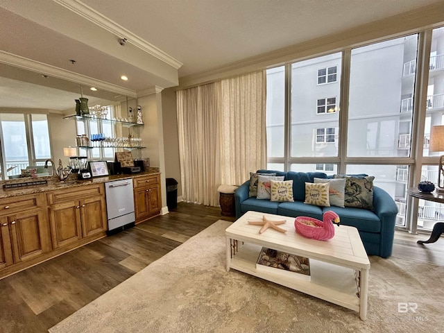 interior space featuring bar area, crown molding, and dark hardwood / wood-style floors