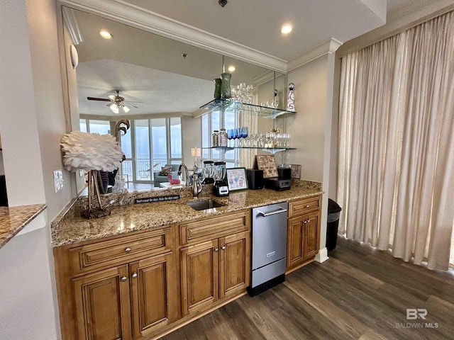 kitchen featuring sink, dishwasher, ceiling fan, dark hardwood / wood-style floors, and crown molding