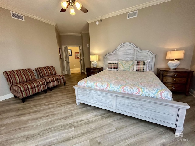 bedroom featuring ceiling fan, ornamental molding, and light hardwood / wood-style flooring