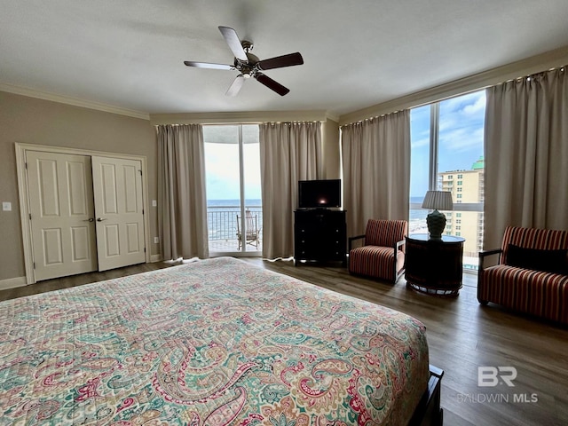 bedroom featuring access to outside, dark wood-type flooring, ceiling fan, and ornamental molding