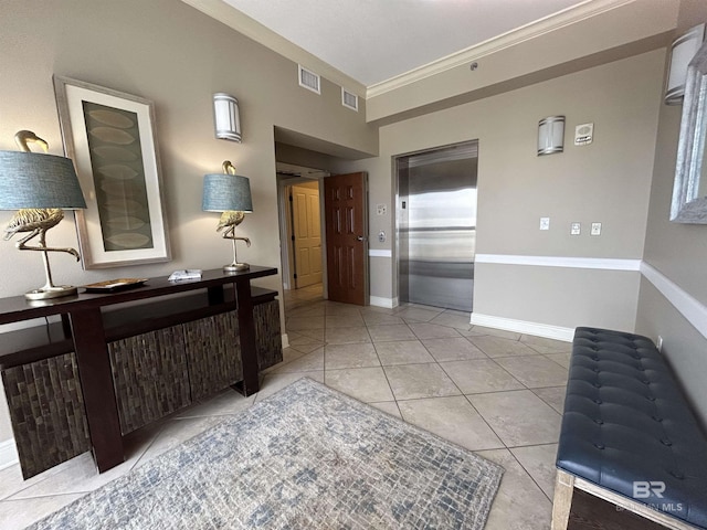 hallway with ornamental molding, elevator, and tile patterned flooring