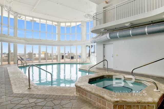 view of pool featuring an indoor hot tub