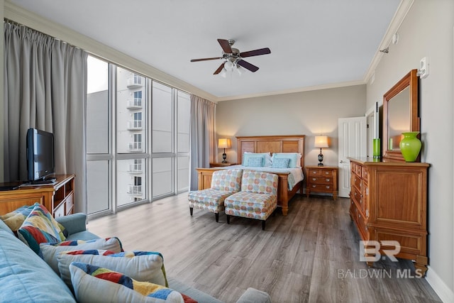 825 W Beach Blvd Unit 9, Gulf Shores, AL 36542 - bedroom featuring wood finished floors, crown molding, and ceiling fan