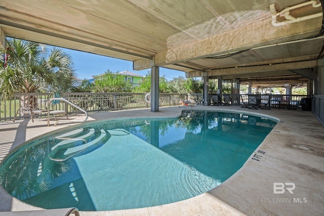 view of swimming pool with a patio area