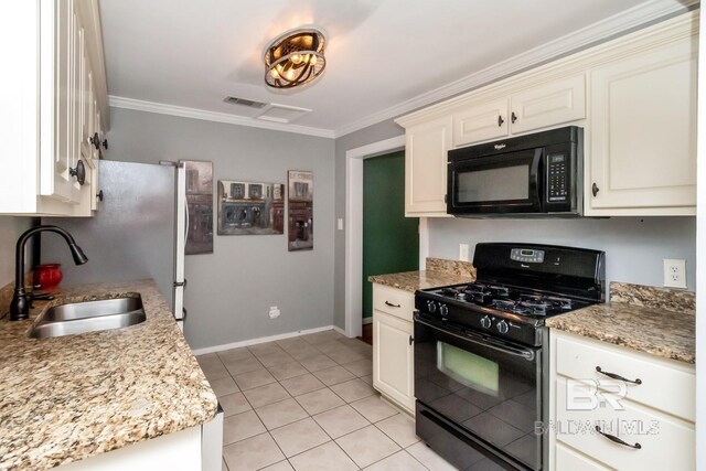 kitchen with light stone countertops, sink, black appliances, light tile patterned flooring, and ornamental molding