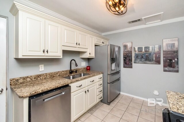 kitchen with light stone counters, stainless steel appliances, crown molding, and sink