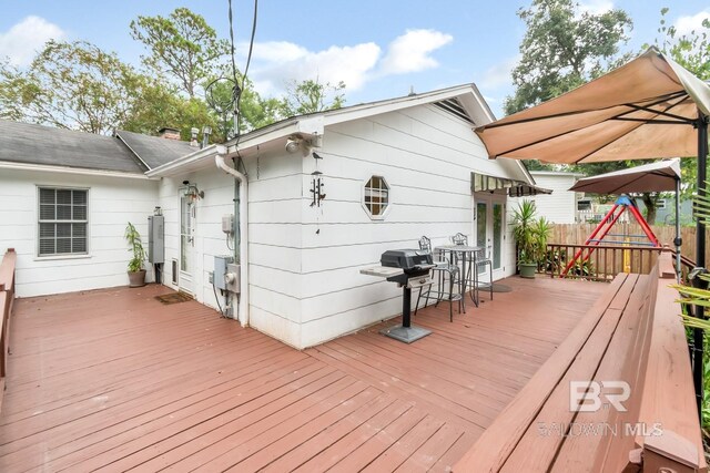 wooden terrace featuring grilling area