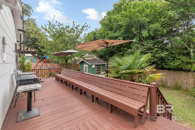 wooden deck with a storage unit