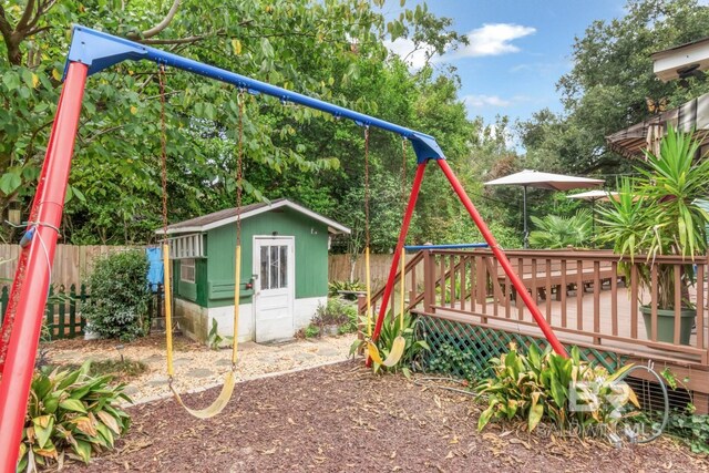 exterior space featuring a storage shed and a deck