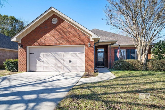 view of front of property with a front yard and a garage