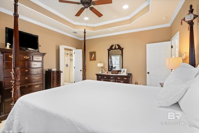 bedroom with ceiling fan, crown molding, and a raised ceiling