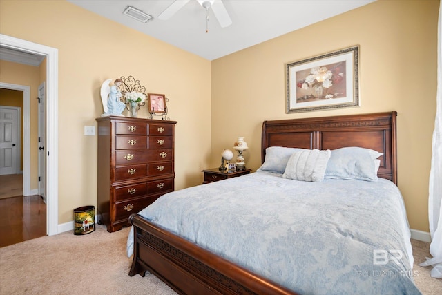 bedroom with ceiling fan and light colored carpet