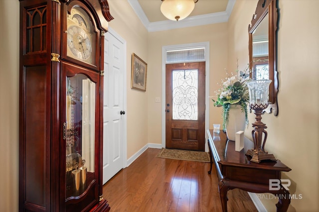 entrance foyer featuring hardwood / wood-style floors and crown molding