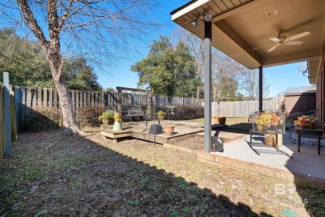 view of yard featuring ceiling fan and a patio area