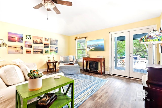 interior space with dark hardwood / wood-style flooring, french doors, ceiling fan, and a wealth of natural light