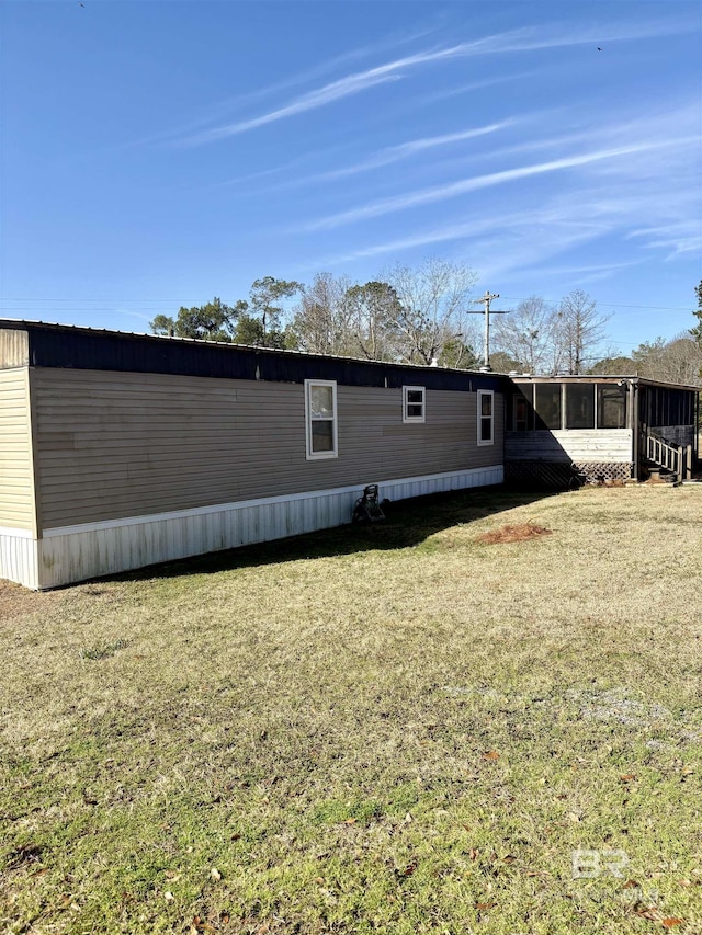 view of property exterior featuring a lawn