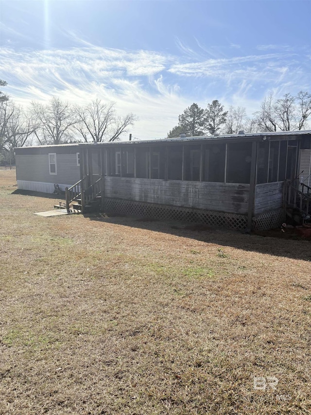 view of yard with a sunroom