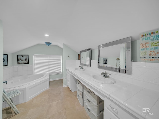 5410 Florida Ave, Orange Beach, AL 36561 - bathroom with double vanity, lofted ceiling, a sink, and tile patterned flooring