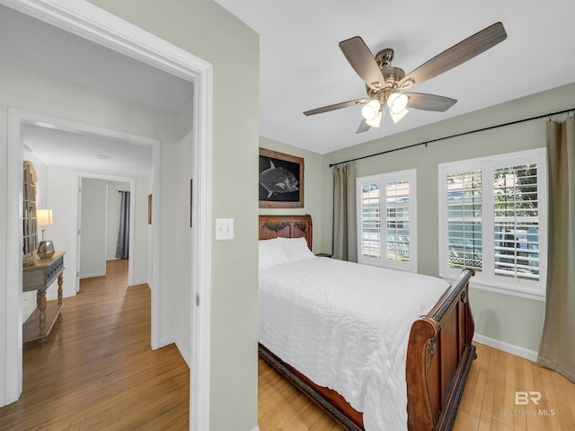 5410 Florida Ave, Orange Beach, AL 36561 - bedroom featuring baseboards, ceiling fan, and light wood finished floors