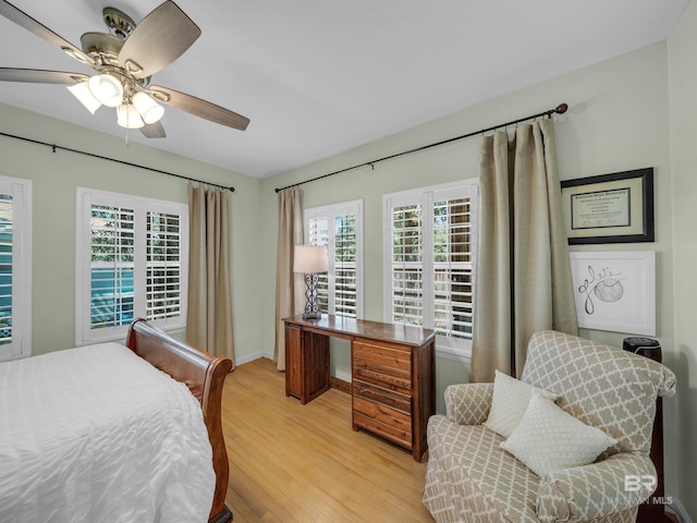 5410 Florida Ave, Orange Beach, AL 36561 - bedroom with baseboards, ceiling fan, multiple windows, and light wood finished floors