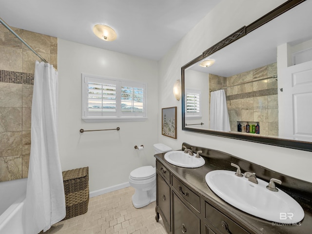 5410 Florida Ave, Orange Beach, AL 36561 - full bath featuring toilet, a sink, tiled shower / bath, and baseboards