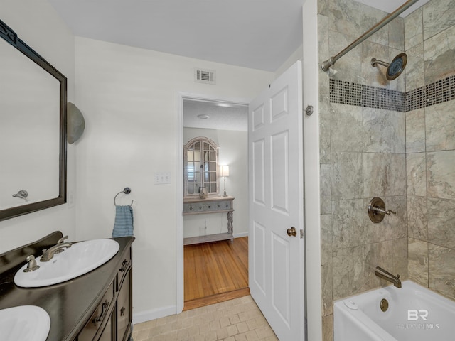 5410 Florida Ave, Orange Beach, AL 36561 - full bathroom with vanity, shower / washtub combination, baseboards, and visible vents