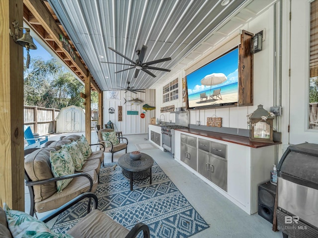 5410 Florida Ave, Orange Beach, AL 36561 - view of patio / terrace featuring fence, an outdoor structure, a storage shed, an outdoor hangout area, and ceiling fan