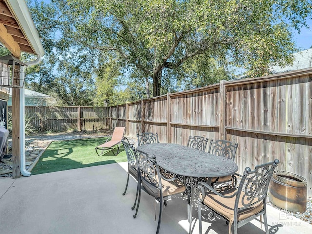 5410 Florida Ave, Orange Beach, AL 36561 - view of patio / terrace with a fenced backyard and outdoor dining space