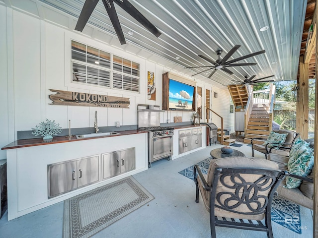 5410 Florida Ave, Orange Beach, AL 36561 - view of patio / terrace with stairs, ceiling fan, a sink, and an outdoor kitchen