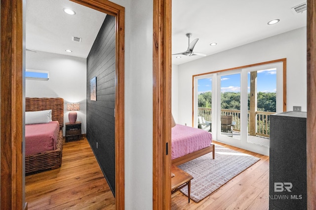 bedroom featuring recessed lighting, wood-type flooring, visible vents, and access to exterior