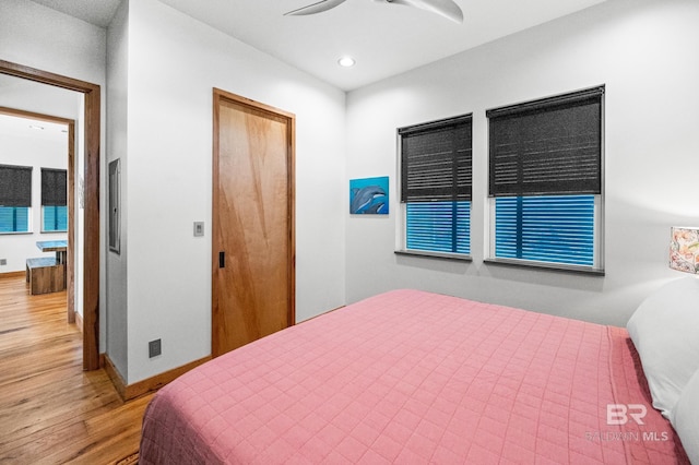 bedroom featuring recessed lighting, ceiling fan, baseboards, and wood finished floors