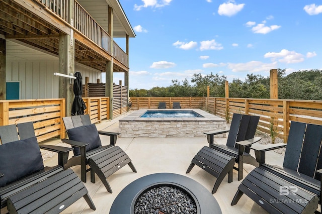 view of patio / terrace with an outdoor hot tub