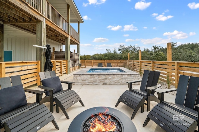 view of patio / terrace with an outdoor hot tub