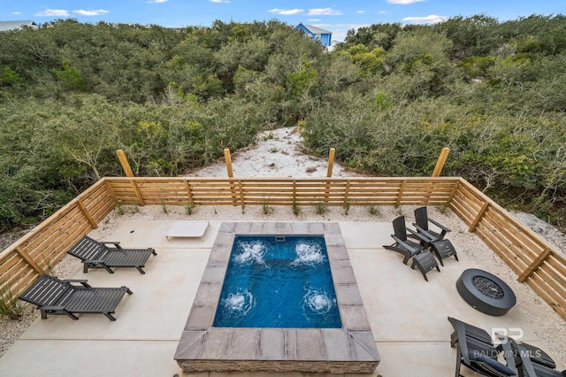 view of pool featuring a patio and fence