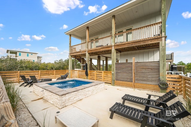 exterior space featuring board and batten siding and a patio area