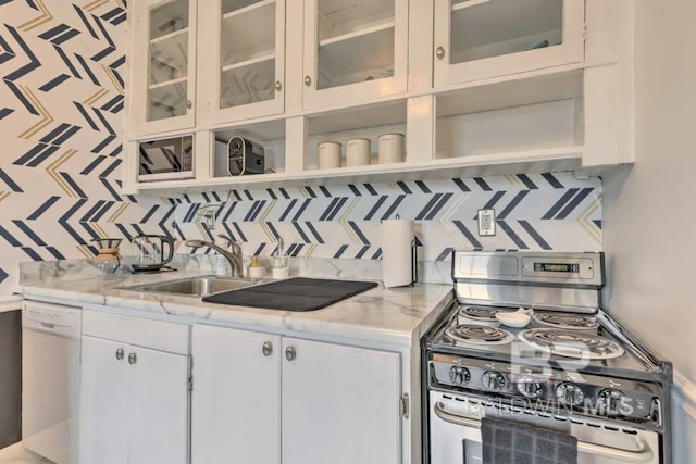 kitchen with tasteful backsplash, white cabinetry, stainless steel range, and dishwasher