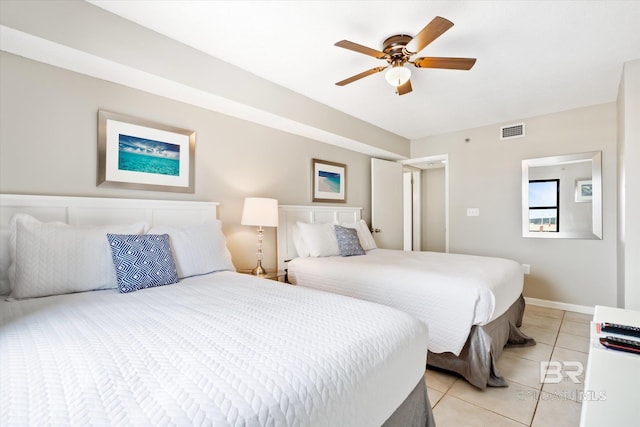 tiled bedroom with ceiling fan