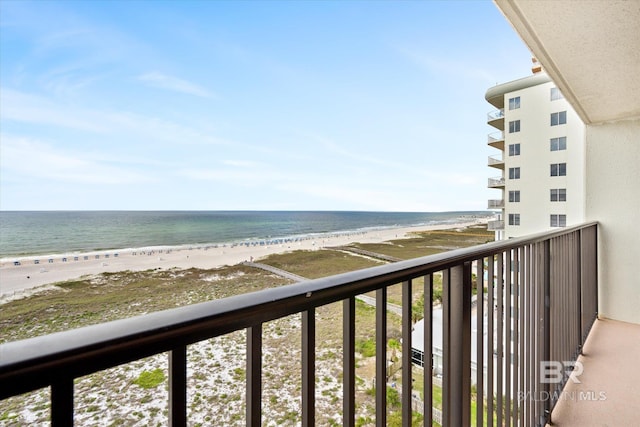 balcony with a water view and a beach view