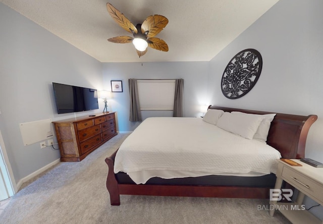 bedroom with light carpet, baseboards, and ceiling fan